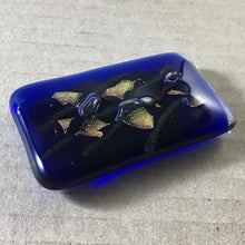 Load image into Gallery viewer, A blue fused-glass magnet with bronze dichroic features.