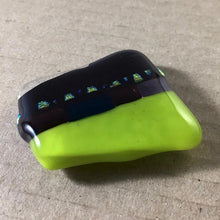 Load image into Gallery viewer, A green and black fused-glass magnet with dichroic features.
