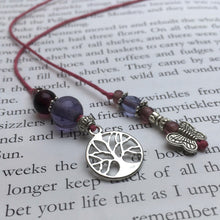 Load image into Gallery viewer, A beaded string bookmark with a silver butterfly and tree-of-life charm.
