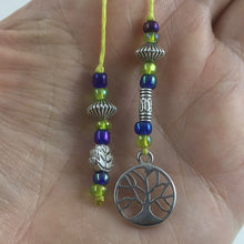 Load image into Gallery viewer, A beaded string bookmark with a silver tree-of-life charm.
