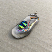 Load image into Gallery viewer, A clear fused-glass pendant with dichroic features.
