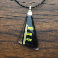Load image into Gallery viewer, A black and clear fused-glass pendant with dichroic features.
