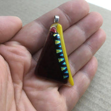 Load image into Gallery viewer, A yellow and red fused-glass pendant with dichroic features.
