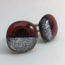 Load image into Gallery viewer, A pair of red fused-glass cufflinks with silver dichroic on half.
